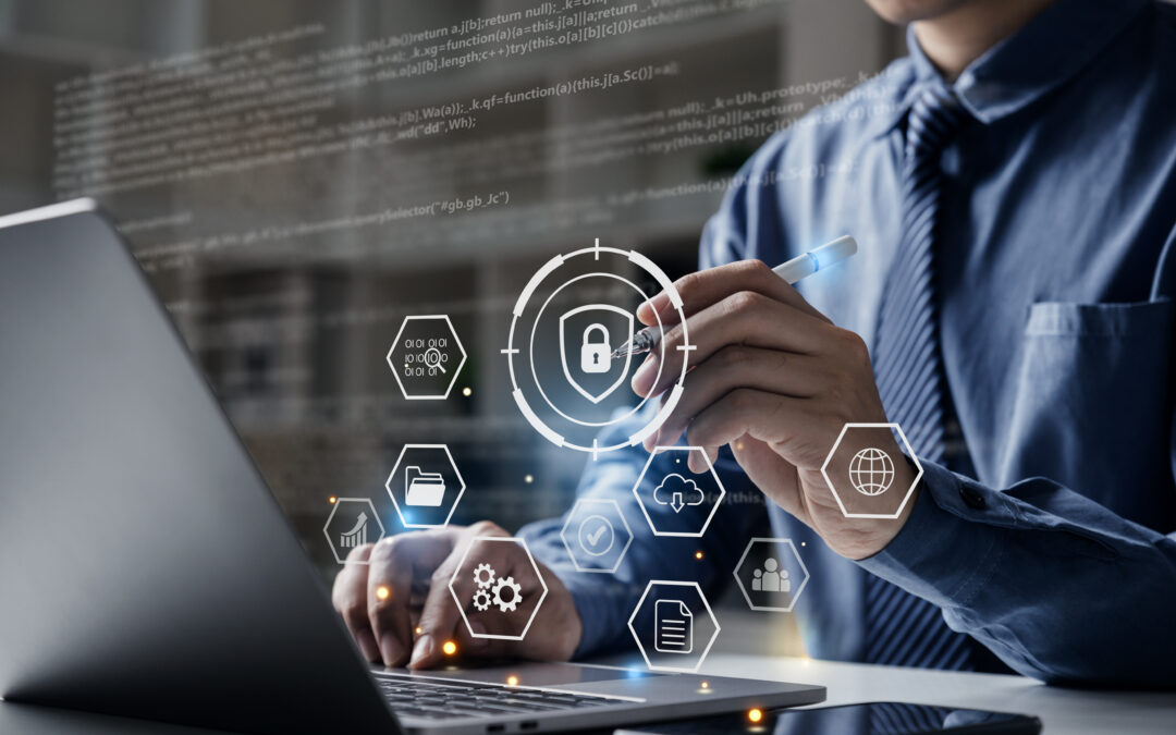 Professional using digital security tools on a laptop, representing managed IT services.