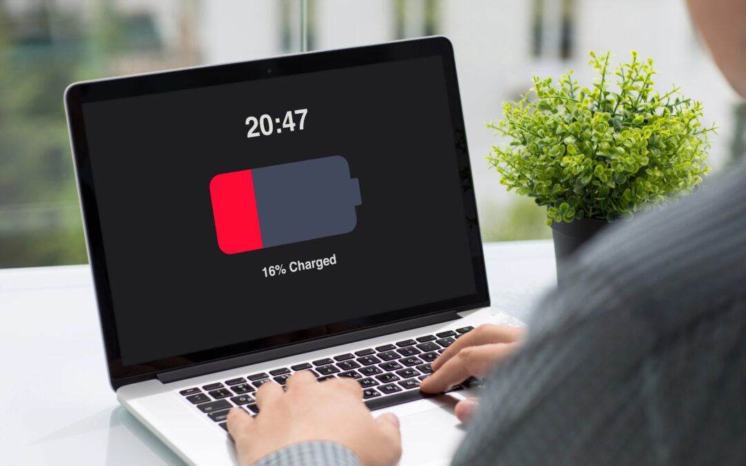 man holding a computer with low charged battery 16978656